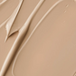 Crème solaire SPF30 teintée en texture légère beige, montrant un contour lisse et fluide sur fond uniforme.