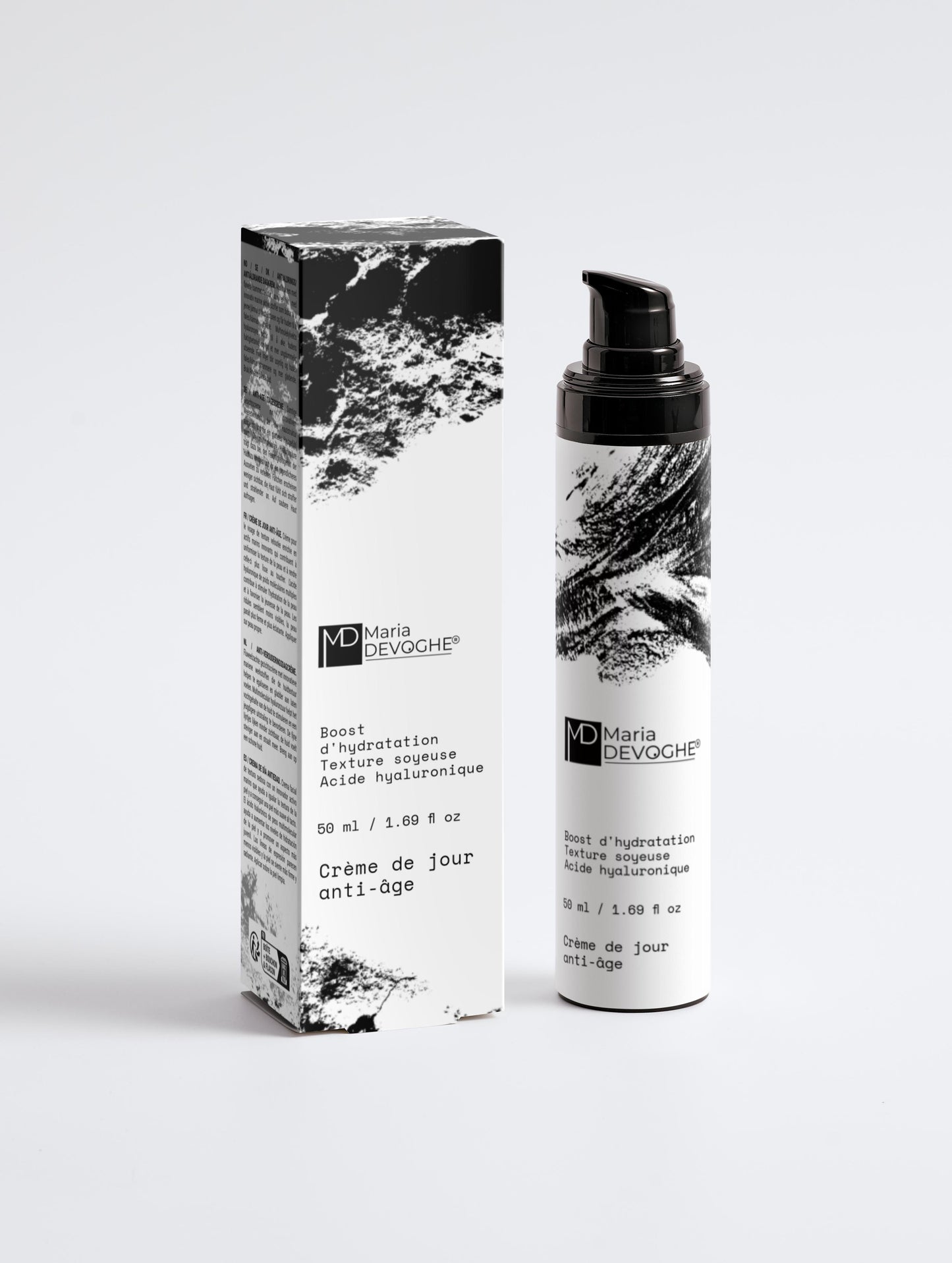 Crème de jour anti-âge Maria Devoghe, flacon pompe noir et texte graphique noir et blanc avec boîte assortie.