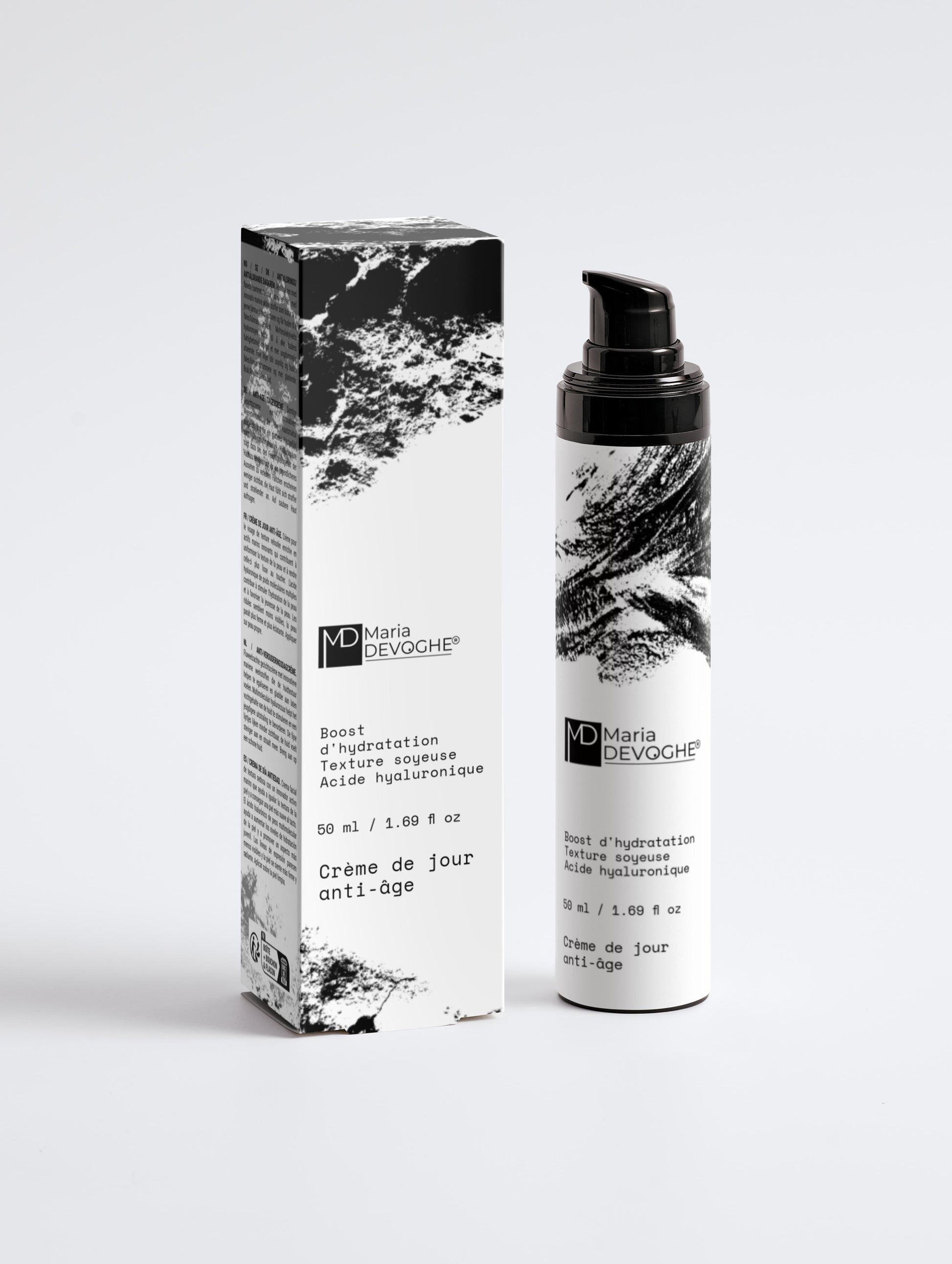 Crème de jour anti-âge Maria Devoghe, flacon pompe noir et texte graphique noir et blanc avec boîte assortie.